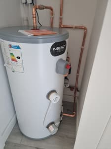 C&B Plumbing and Gas engineer installing boiler in Hull